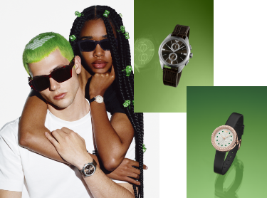 Male and female models posing with Emporio Armani watches. Male and female watches on green background.