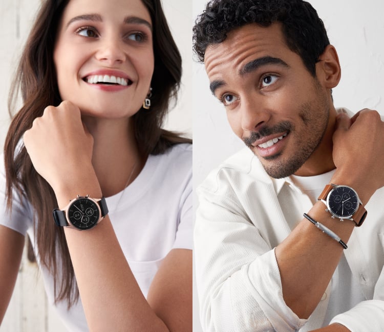 Woman wearing Skagen's Hybrid HR smartwatch featuring black leather strap.
