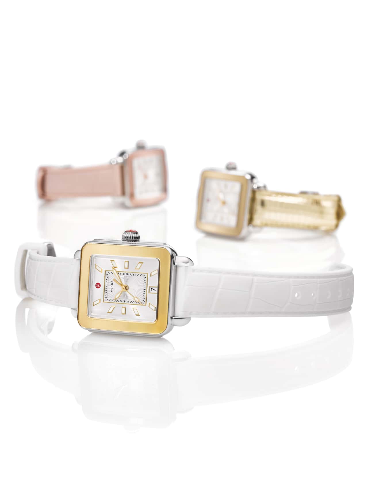 Three Deco Sport watches with white, pink and gold-tone straps.