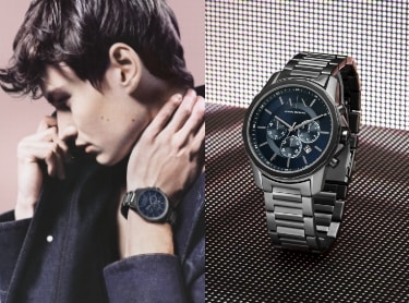 Male model wearing an Armani Exchange watch.