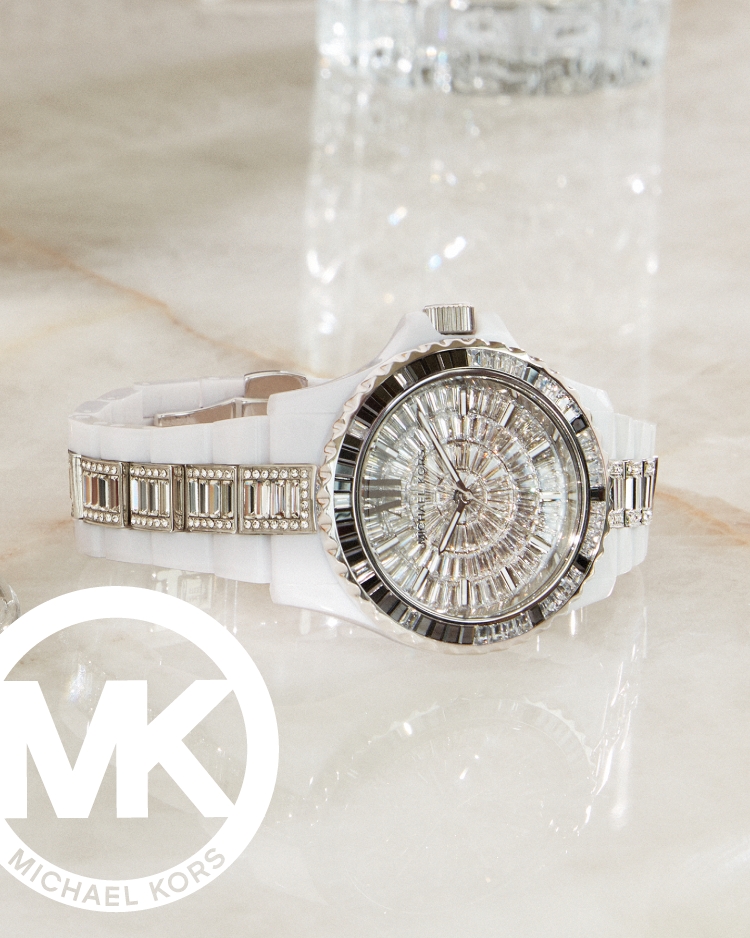 Stylish woman wearing pavé Michael Kors jewelry.