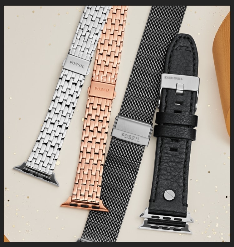 Four Apple Watch bands in different colors and materials.