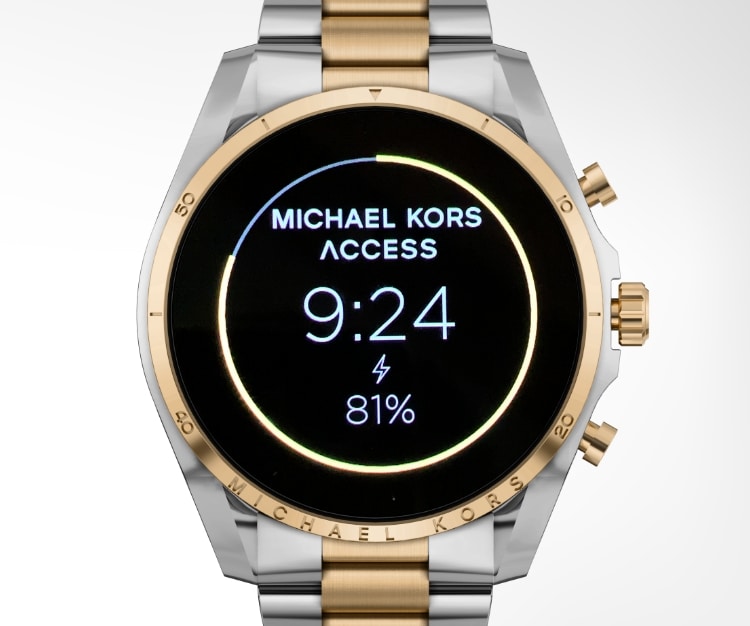 Two-tone Michael Kors Gen 6 smartwatch. Wear OS by Google logo.
