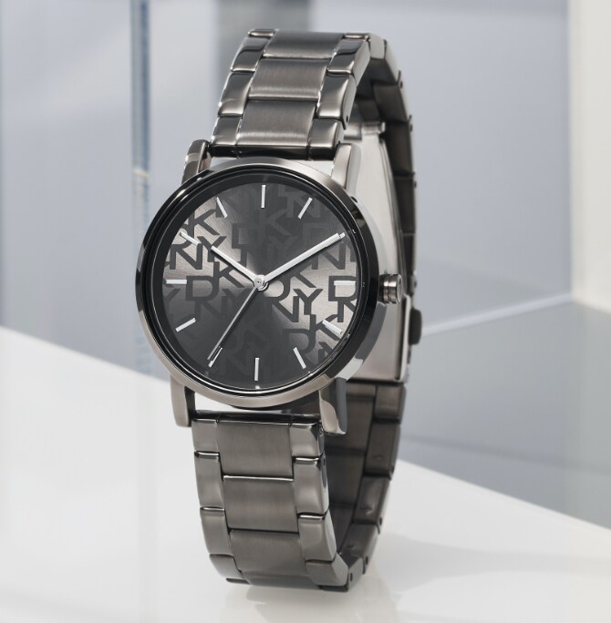 Gunmetal and silver-tone DKNY watches featuring signature town and country logo.