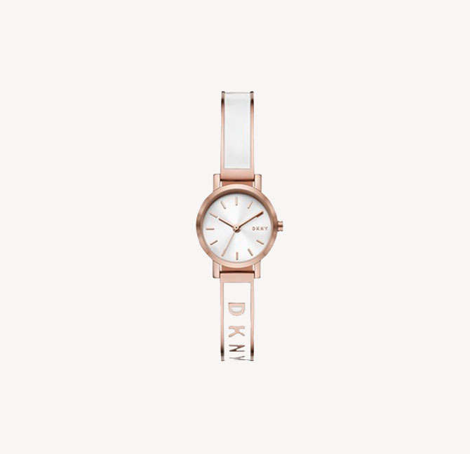 gold-tone DKNY watch with a metal bracelet