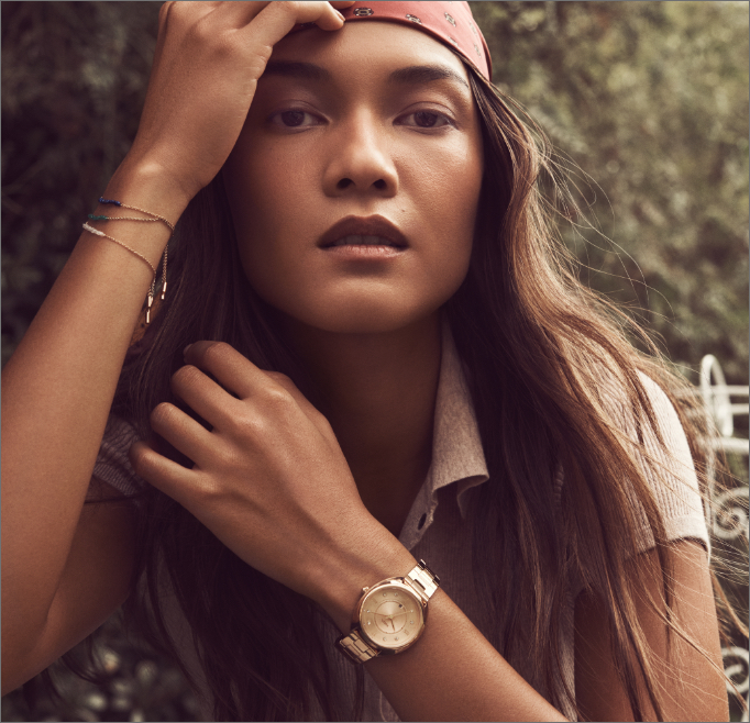 Stylish young woman wearing Fossil's Gabby 70s-inspired Gabby watch.