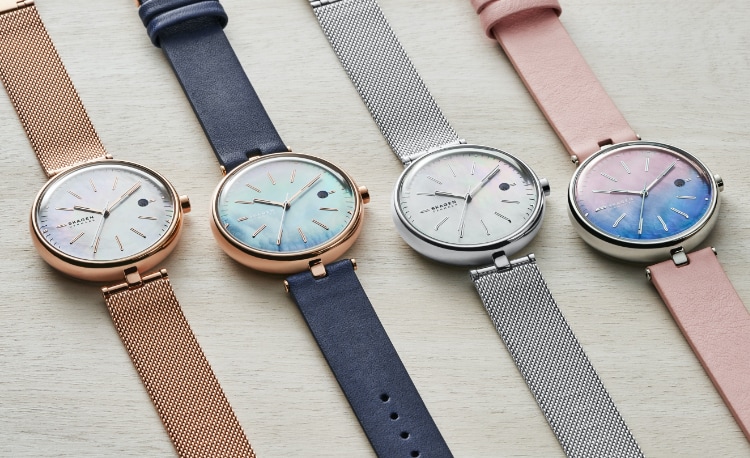 Solar power Skagen watches in all rose gold-tone, navy with rose gold-tone, silver-tone, and pink with silver-tone.