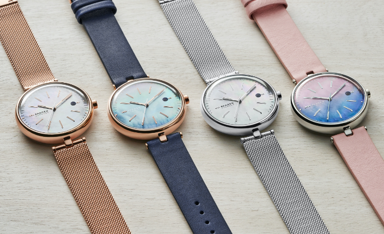Solar power Skagen watches in all rose gold-tone, navy with rose gold-tone, silver-tone, and pink with silver-tone.