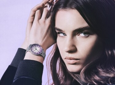 Silver women’s watch with a light purple face.