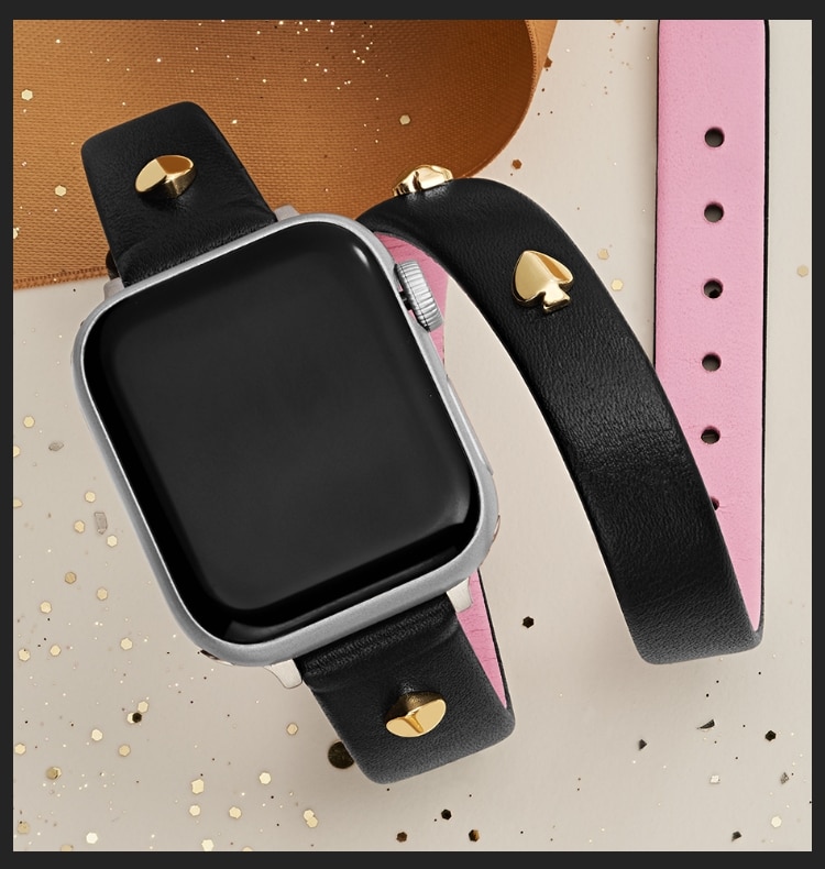 Four Apple Watch bands in different colors and materials.