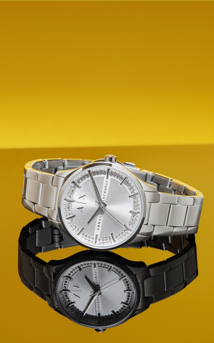 Montre A|X pour femme en acier inoxydable avec cadran entouré de cristaux scintillants.