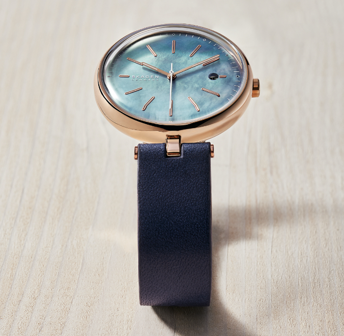 Solar power Skagen watches in all rose gold-tone, navy with rose gold-tone, silver-tone, and pink with silver-tone.