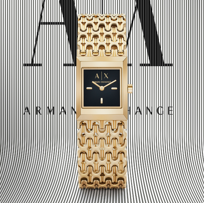 Modern, stylish woman wearing black and white A|X watch.