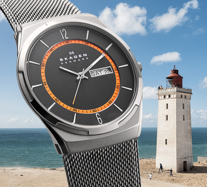 Deux montres Melbye de Skagen en bronze industriel pour hommes; une avec l’intérieur de chiffres pour le suivi des secondes bleu et une avec l’intérieur de chiffres pour le suivi des secondes orange