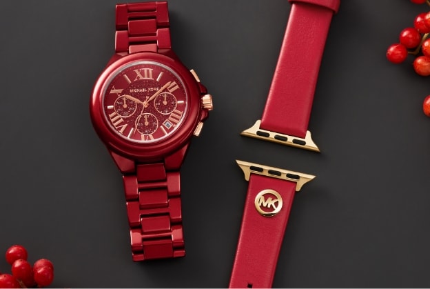 Montre Michael Kors rouge avec un bracelet pour Apple Watch rouge.